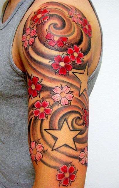 Tatuaje flores de cerezo y estrellas