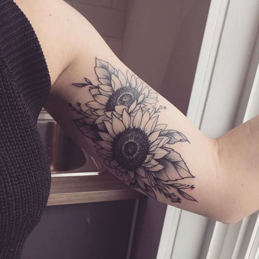 Tatuaje de girasoles en el brazo
