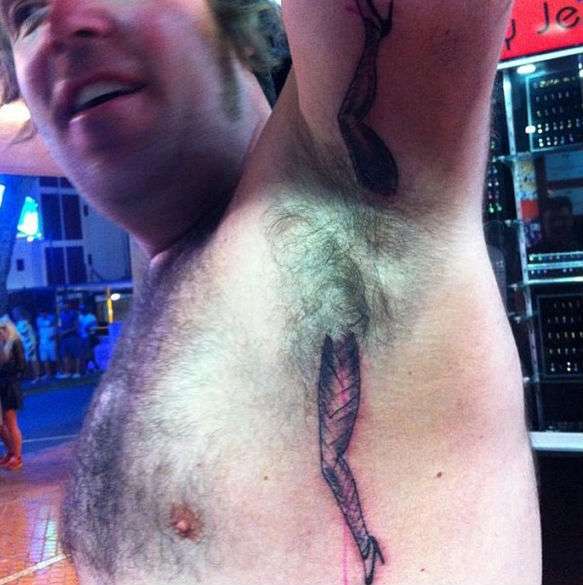 Funny tattoos: legs in the armpit