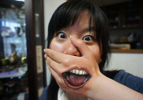Funny tattoos: mouth in the hand