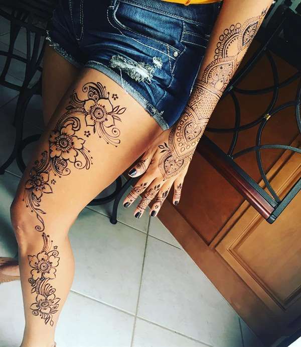 Tatuaje de henna en brazo y pierna