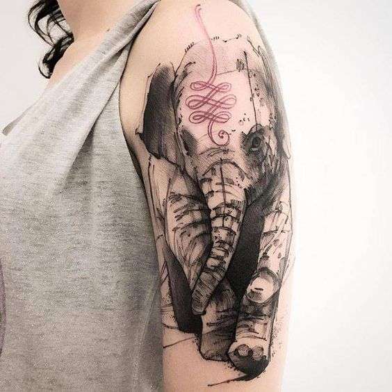 Tatuaje de elefante con detalle en rojo